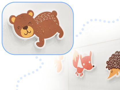 Cartoon bear on a white background with other animals.

